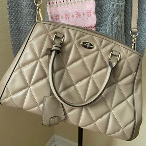 Quilted coach cross body bag
